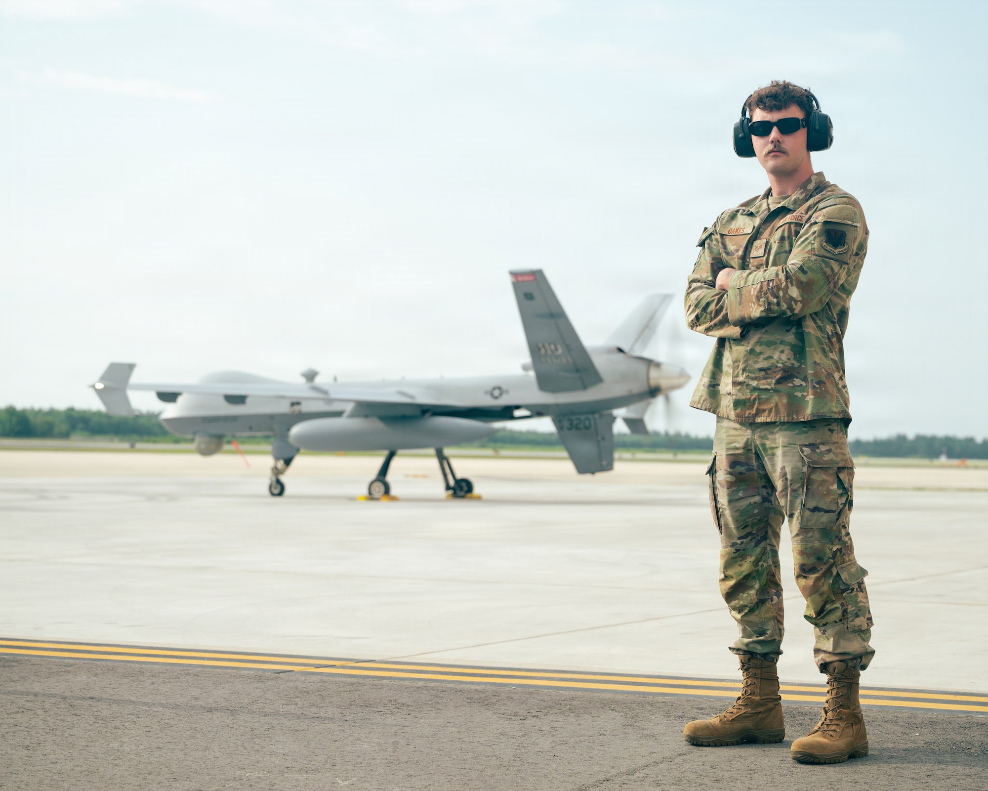 U.S. Air Force Staff Sgt. Lawson Oakes, 29th Aircraft Maintenance Unit dedicated crew chief, poses for a portrait at Alpena Combat Readiness Training Center, Michigan, July 21, 2026.