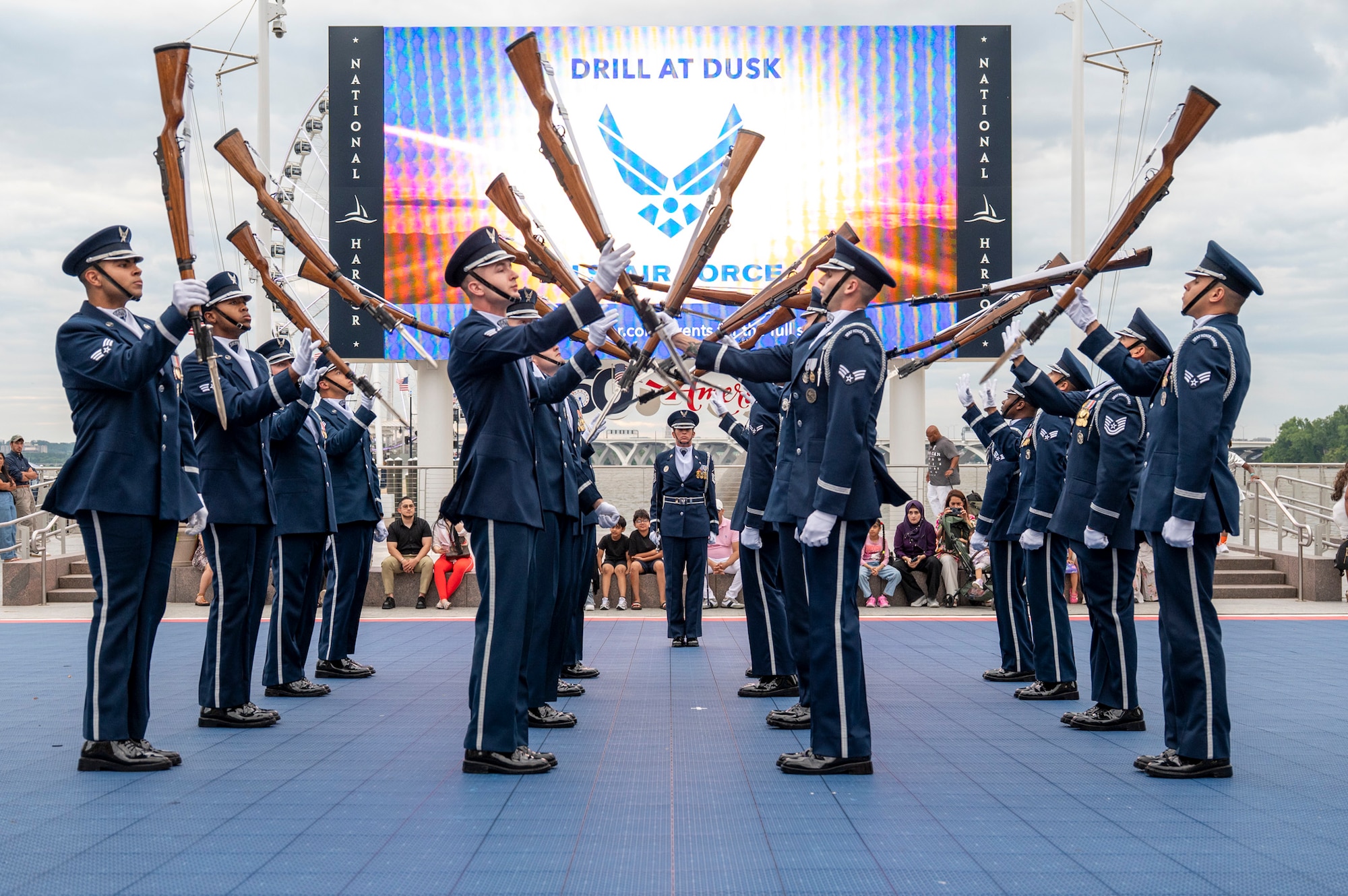 U.S. Air Force Honor Guard Drill Team performs in front of a crowd