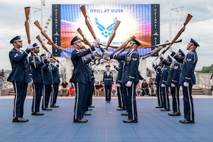 The U.S. Air Force Honor Guard Drill Team performs at National Harbor, Md., July 29, 2026. The Drill Team’s performance was part of Drill at Dusk, a summer community engagement series which showcased military ceremonial traditions and connected service members with the local community. (U.S. Air Force photo by Airman 1st Class Arlene Carrara)