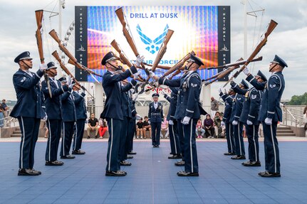 U.S. Air Force Honor Guard Drill Team performs in front of a crowd