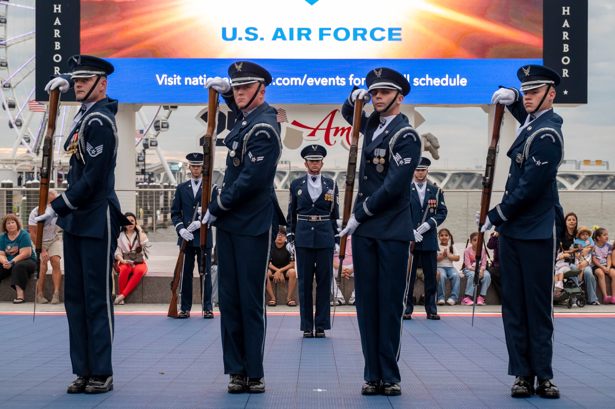 U.S. Air Force Master Sgt. stands in the center of the U.S. Air Force drill team as they perform
