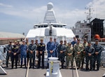 Navy leaders from the United States, the Netherlands, Dominican Republic, Panama and Colombia pose for a picture aboard a ship.