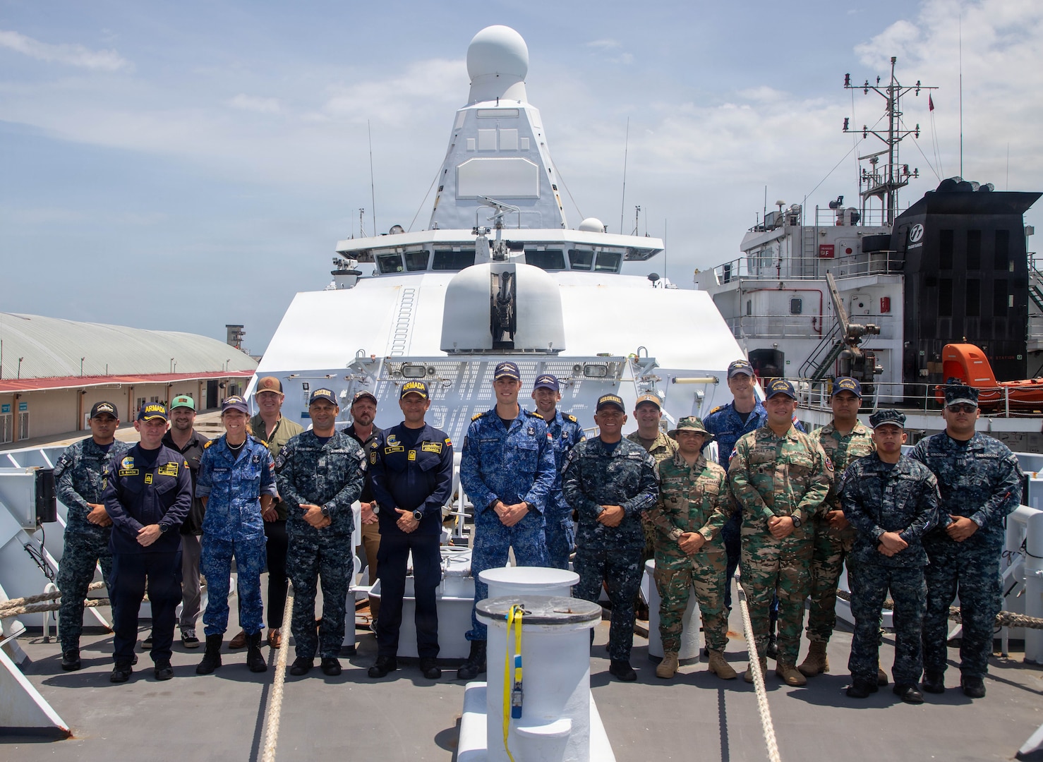 Navy leaders from the United States, the Netherlands, Dominican Republic, Panama and Colombia pose for a picture aboard a ship.