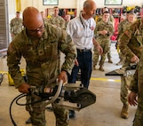 Students of the Arkansas National Guard’s Guardian Response Training Academy receive hands-on training with vehicle extrication equipment Aug. 5, 2026, at Camp Joseph T. Robinson, Ark.