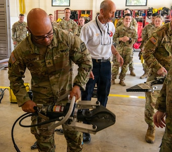 Students of the Arkansas National Guard’s Guardian Response Training Academy receive hands-on training with vehicle extrication equipment Aug. 5, 2026, at Camp Joseph T. Robinson, Ark.