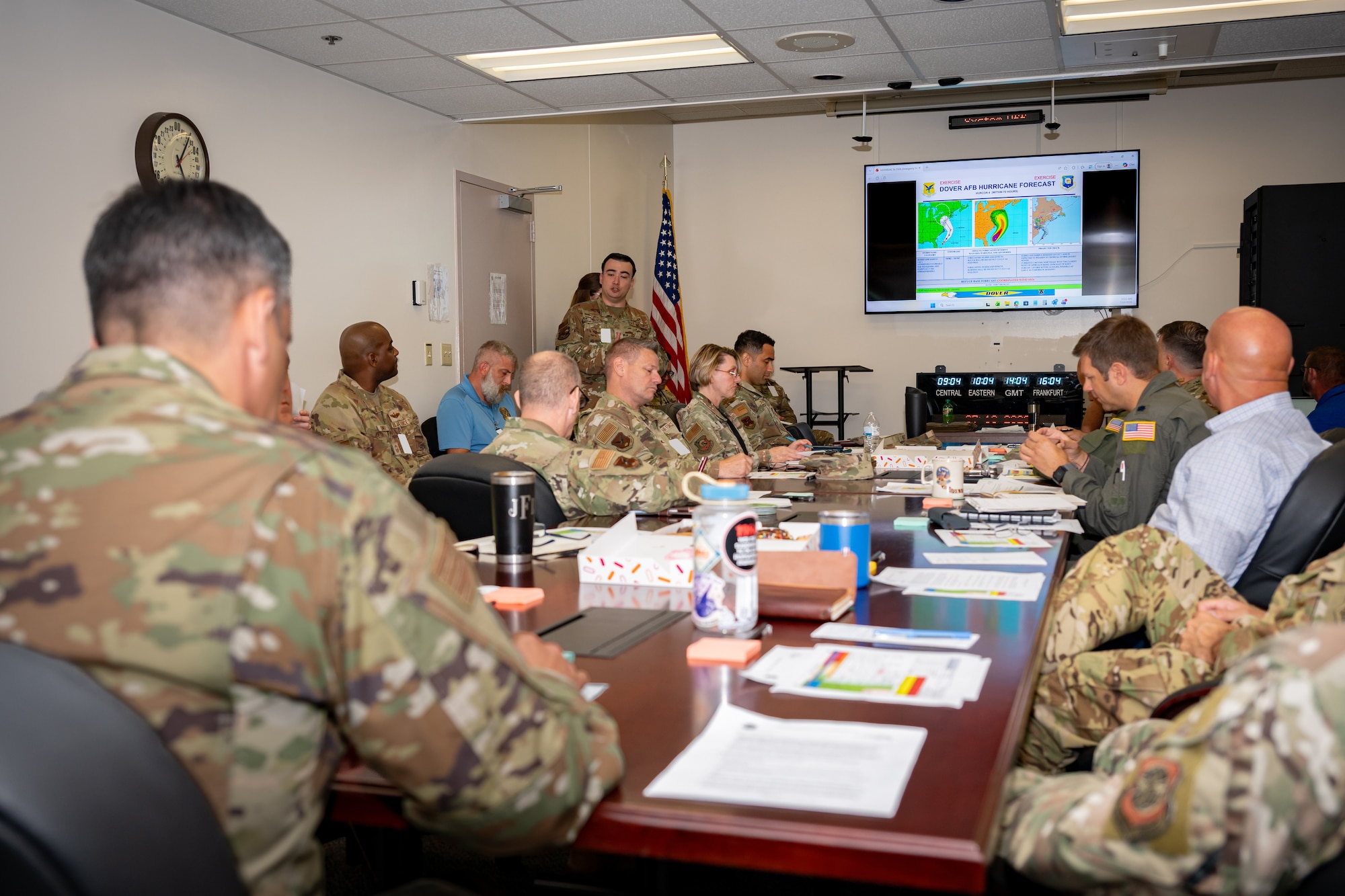Leaders of the 436th Airlift Wing discuss response actions during a tropical storm tabletop exercise at Dover Air Force Base, Delaware, July 16, 2026. The exercise allowed leaders to rehearse the flow of information to the commander, assess potential storm impacts and strengthen coordination across the installation before a real-world emergency. (U.S. Air Force photo by Senior Airman Keira Rossman)