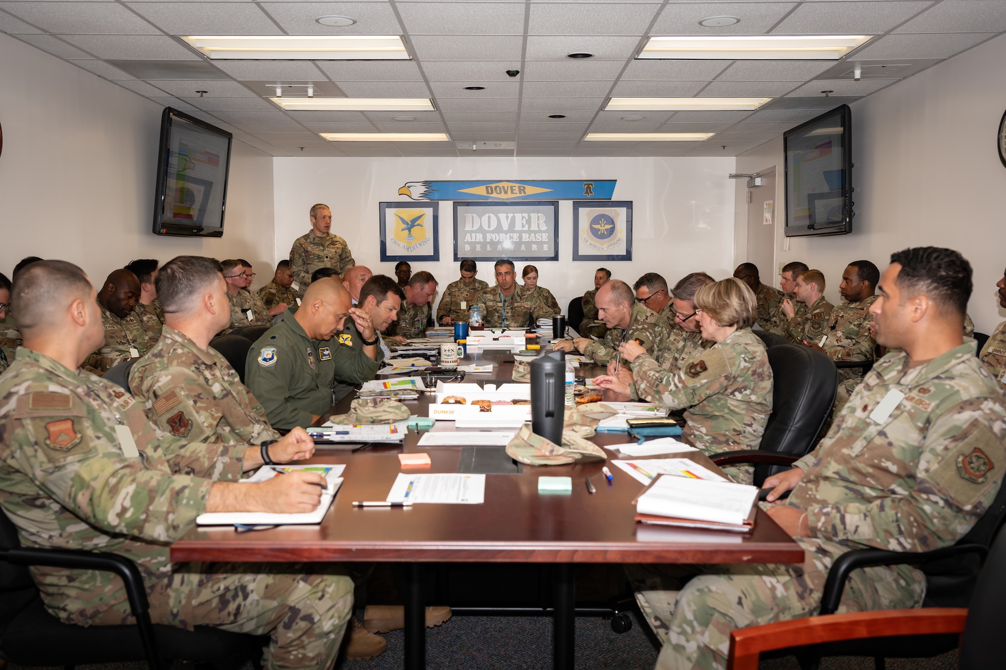 Participants in the 436th Airlift Wing’s tropical storm tabletop exercise, review emergency response procedures at Dover Air Force Base, Delaware, July 16, 2026. Participants worked through a simulated scenario, sharing information from their respective units to help installation leadership evaluate response options and protect personnel, resources and mission capabilities. (U.S. Air Force photo by Senior Airman Keira Rossman)