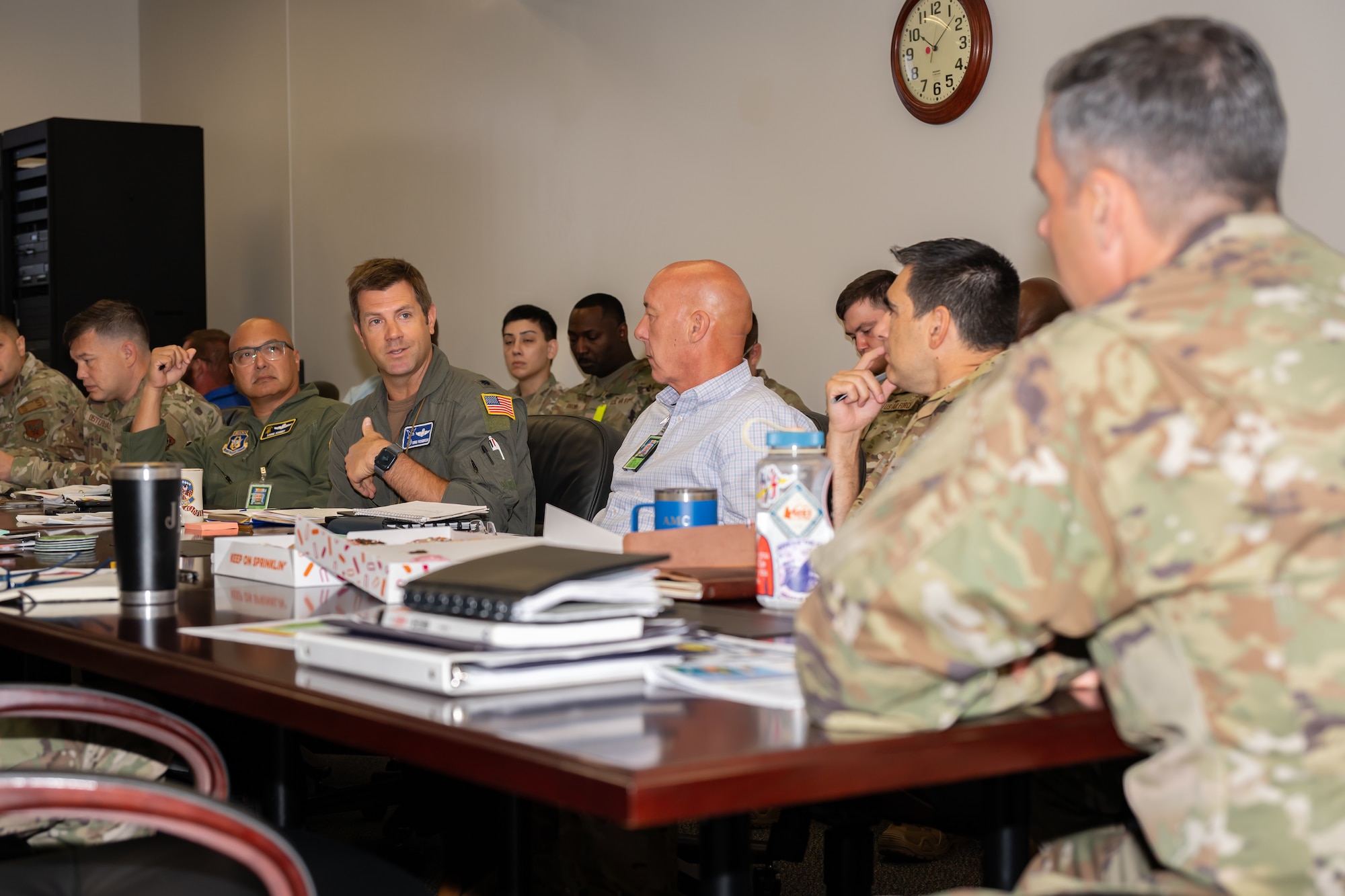 Leaders of the 436th Airlift Wing participate in a tropical storm tabletop exercise at Dover Air Force Base, Delaware, July 16, 2026. During the discussion-based exercise, representatives from across the installation reviewed a simulated storm scenario and provided updates on unit capabilities, resources and potential impacts to support commander decision-making. (U.S. Air Force photo by Senior Airman Keira Rossman)