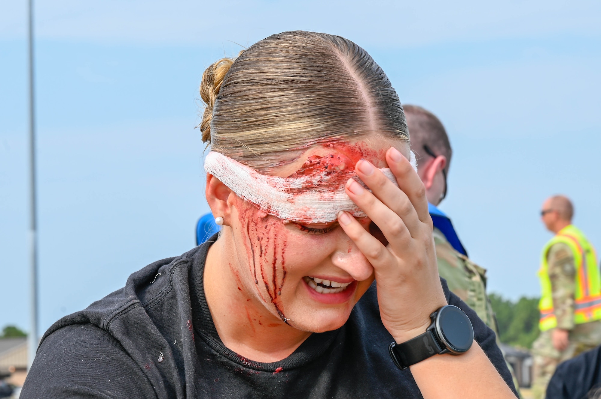 A person holds their head in pain.