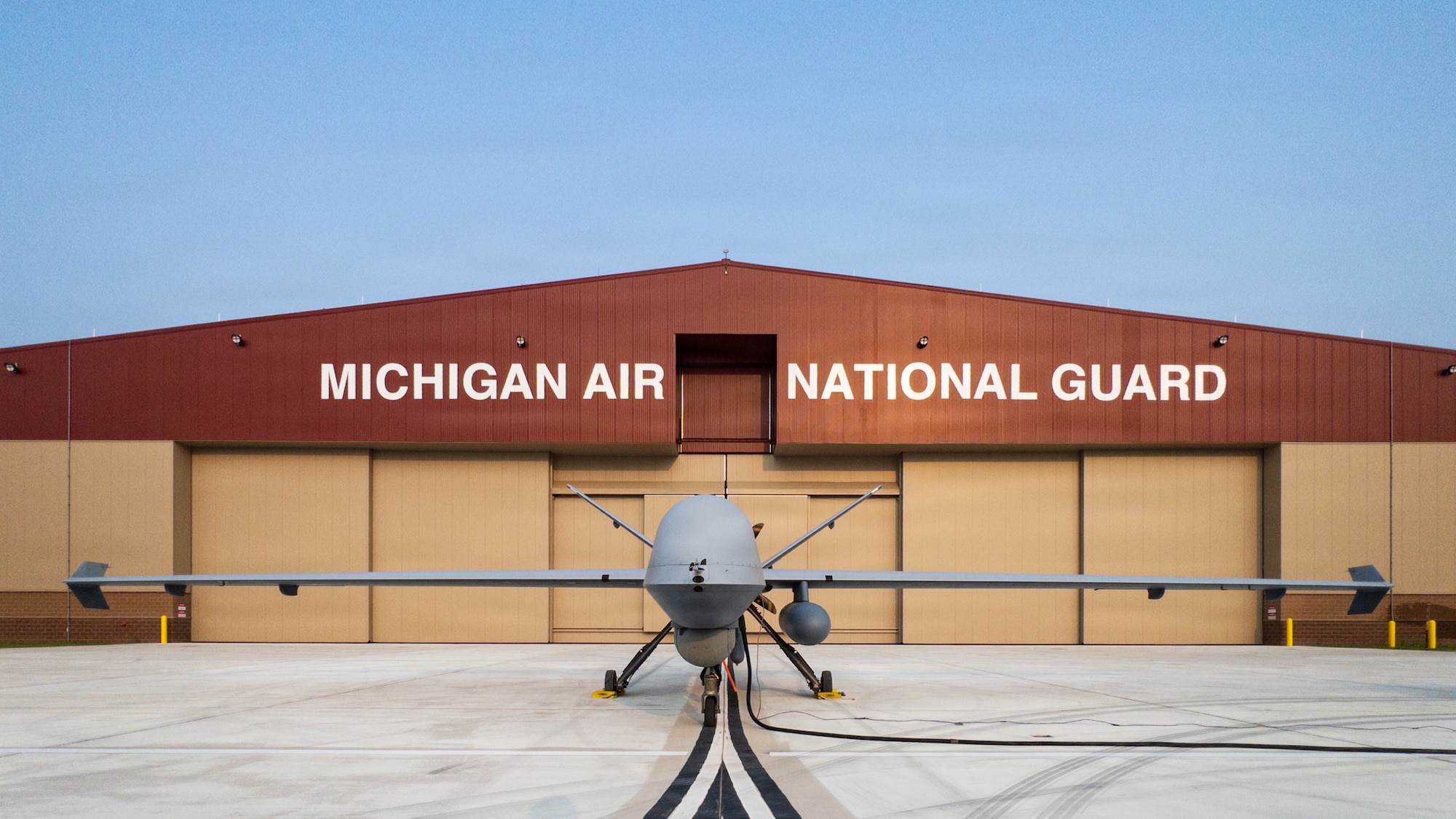 An MQ-9 Reaper assigned to the 29th Attack Squadron is parked outside a Michigan Air National Guard hangar at Alpena Combat Readiness Training Center, Michigan, July 20, 2026.