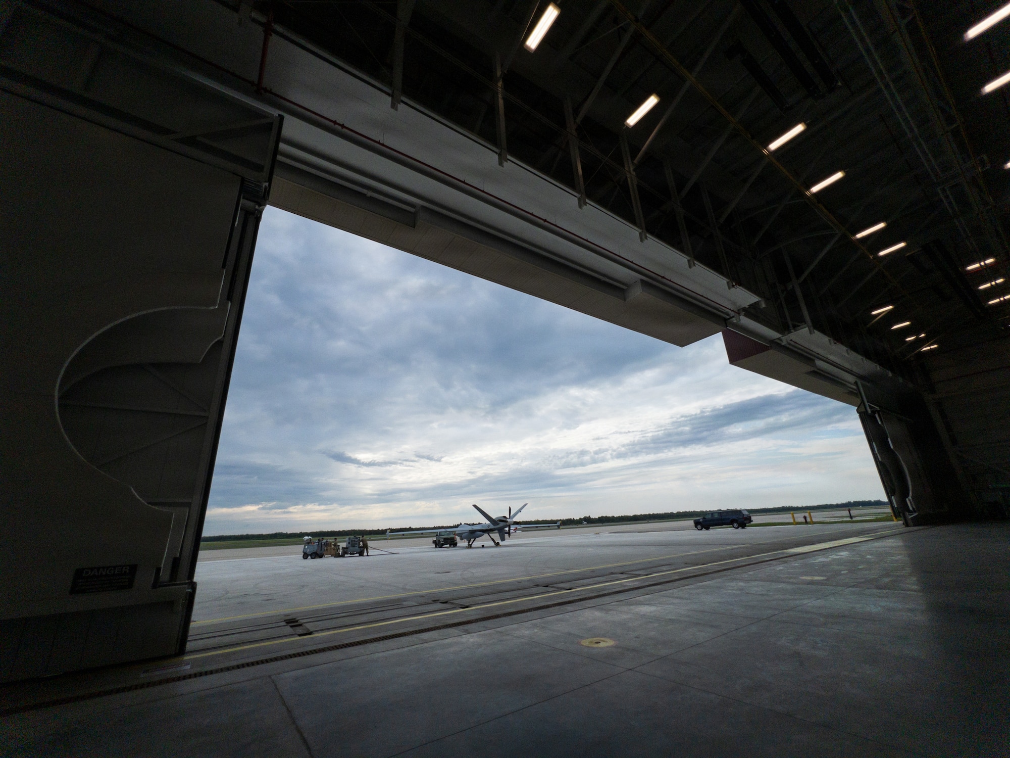 An MQ-9 Reaper assigned to the 29th Attack Squadron is parked outside the Michigan Air National Guard hangar at Alpena Combat Readiness Training Center, Michigan, July 21, 2026.