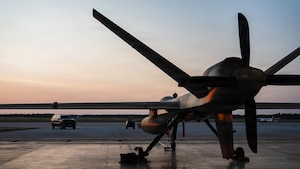 An MQ-9 Reaper assigned to the 29th Attack Squadron is parked outside a hangar prior to a morning launch at Alpena Combat Readiness Training Center, Michigan, July 24, 2026.