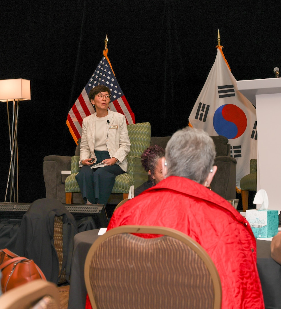 Dr. Jennie Jin, Defense POW/MIA Accounting Agency Scientific Analysis Special Projects & Disinterment Manager, speaks to family members at DPAA’s 2026 Korean/Cold War Annual Government Briefings in Omaha, Nebraska, August 6, 2026.