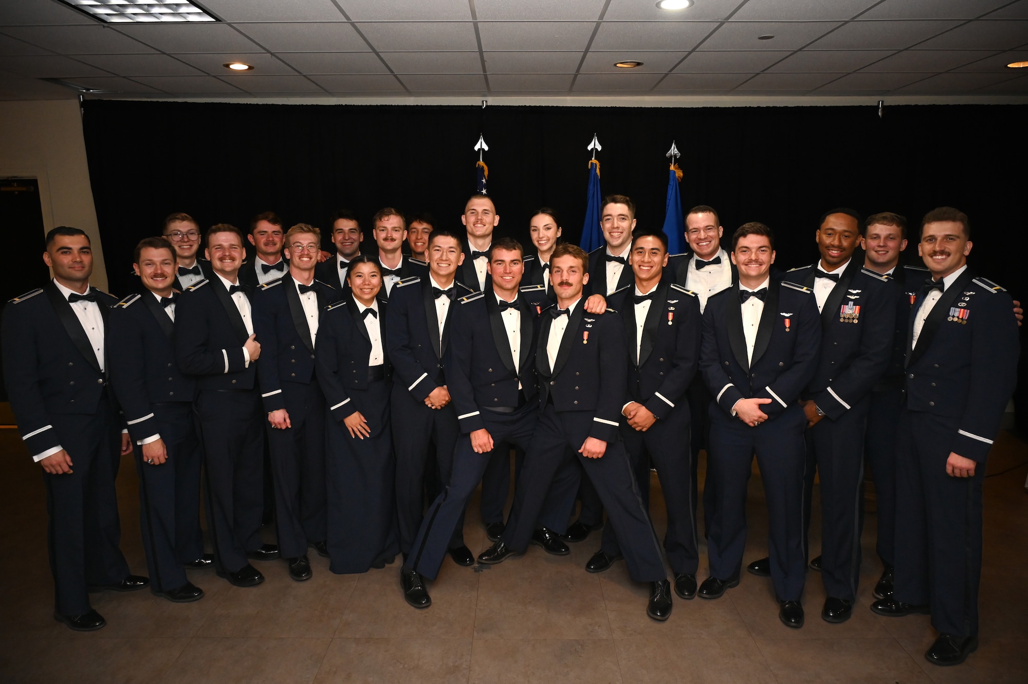 Student pilots from the 47th Student Squadron graduating Class 26-15 come together for a group photo at Laughlin Air Force Base, Texas, Aug. 6, 2026. Twenty-three U.S. Air Force officers were recognized for successfully completing Undergraduate Pilot Training during a graduation ceremony. (U.S. Air Force photo by Airman 1st Class Kylie Rabb)