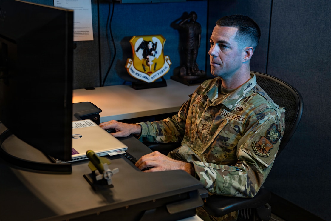 U.S. Air Force Master Sgt. Pete Nunes, Air Force Global Strike Command B-2 armament inspector, works at his desk at Barksdale Air Force Base, Louisiana, Aug. 4, 2026. Nunes serves as Air Force Global Strike Command's sole B-2 armament inspector. (U.S. Air Force photo by Senior Airman Rhea Beil)