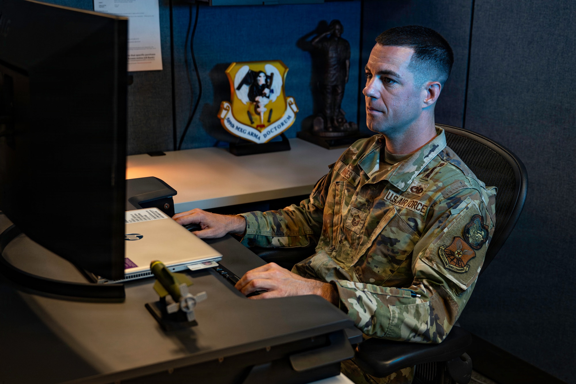 U.S. Air Force Master Sgt. Pete Nunes, Air Force Global Strike Command B-2 armament inspector, works at his desk at Barksdale Air Force Base, Louisiana, Aug. 4, 2026. Nunes serves as Air Force Global Strike Command's sole B-2 armament inspector. (U.S. Air Force photo by Senior Airman Rhea Beil)