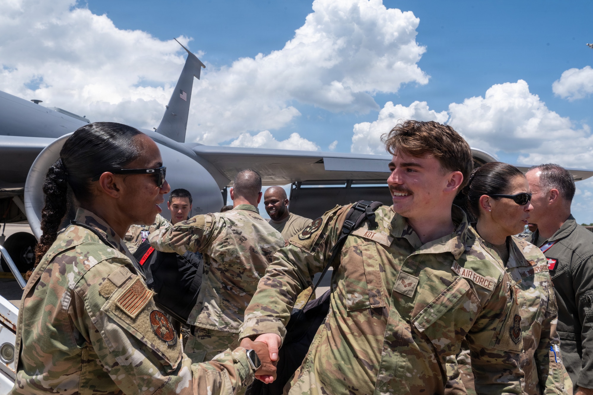 U.S Air Force Senior Master Sgt. Asia Cook, 6th Aircraft Maintenance Unit flight chief, greets Senior Airman Alexander Kot, 6th AMXS aircraft propulsion apprentice, during a redeployment at MacDill Air Force Base, Florida, July 2, 2026. Family members, friends and fellow Airmen gathered to celebrate the safe return of deployed personnel following their overseas mission. (U.S. Air Force photo by Airman Micquill Davis)
