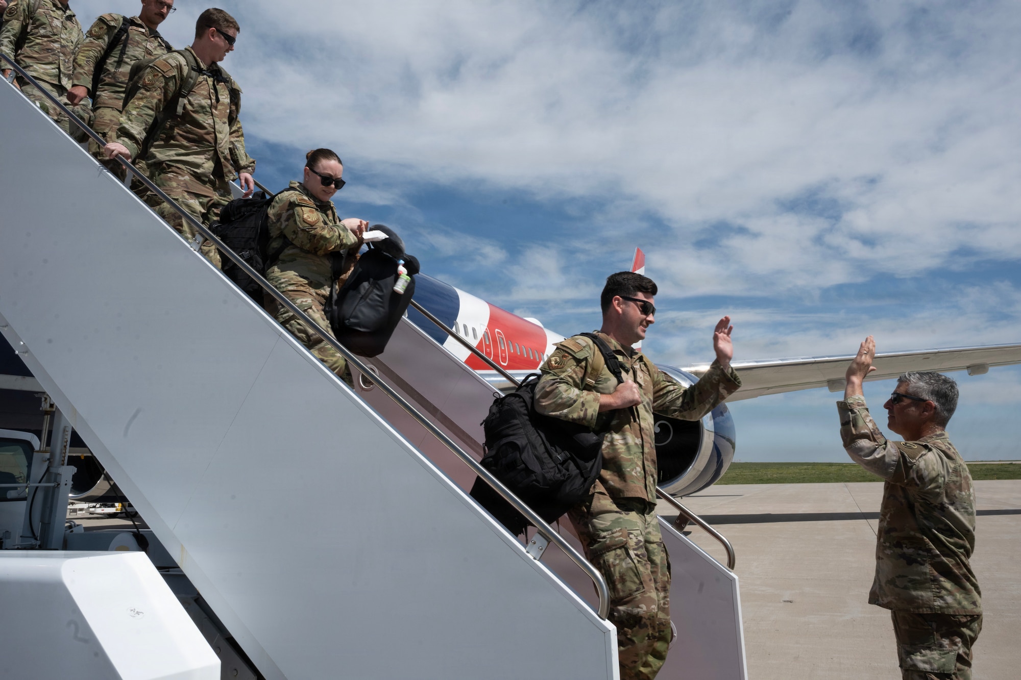 Airmen assigned to the 140th Wing reunite with family, friends, and loved ones following a successful deployment to Kadena Air Base, June 5, 2026 at Buckley Space Force Base, Colorado. During the deployment, Airmen supported Indo-Pacific operations alongside joint and allied partners, contributing to F-16 combat airpower generation, airlift operations, readiness training and mission support efforts across the region. The homecoming marked the successful return of the unit and celebrated the dedication, resilience and service of the Airmen and the families who supported them throughout the deployment. (U.S. Air National Guard photo by Senior Airman Kylie Davidson)