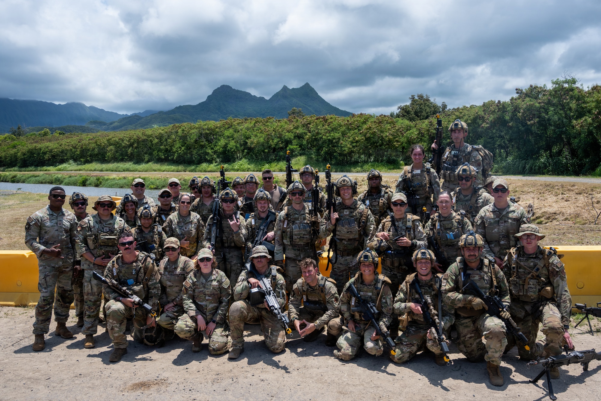 Members of the 140th Security Forces Squadron pose for a group photo after completing Operation Iron Flag, a hands-on, combat simulation field exercise June 17, 2026, at Bellows Air Force Station, Hawaii. The 140th SFS implemented jungle warfare movements, land navigation and nonverbal signals as part of their annual training. (U.S. Air National Guard photo by Senior Airman Eliana Raspet)