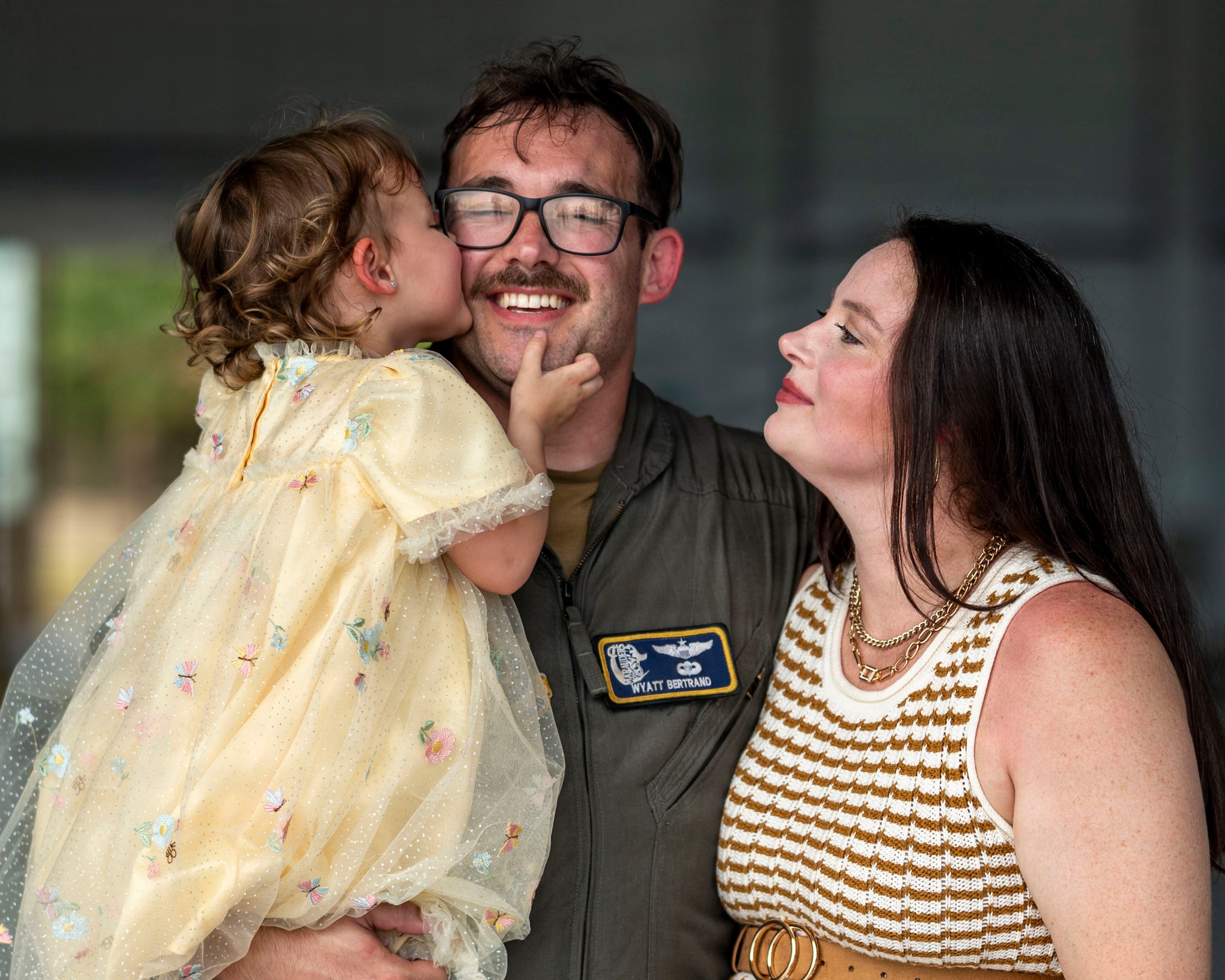 U.S. Air Force Capt. Wyatt Bertrand, 91st Air Refueling Squadron Pilot, is greeted by his daughter during a redeployment at MacDill Air Force Base, Florida, July 3, 2026. Military families provide the foundation that enables the 6th Air Refueling Wing to generate combat-ready Airmen and project airpower across the globe. (U.S. Air Force photo by Senior Airman Monique Stober)
