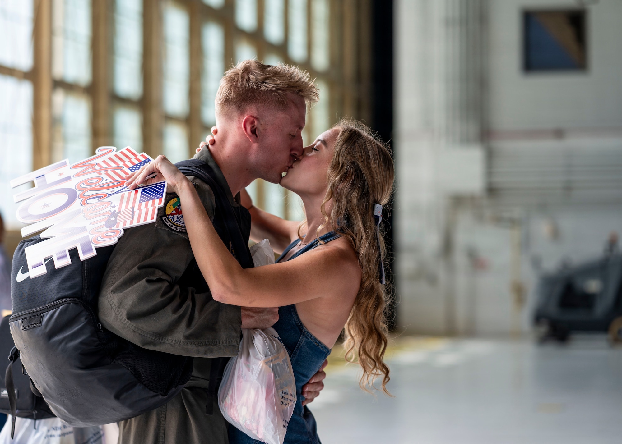 U.S. Air Force Capt. Zachary Dicken, 91st Air Refueling Wing pilot, is welcomed home by a loved one during a redeployment at MacDill Air Force Base, Florida, July 3, 2026. Military families provide the foundation that enables the 6th Air Refueling Wing to generate combat-ready Airmen and project airpower across the globe. (U.S. Air Force photo by Senior Airman Monique Stober)