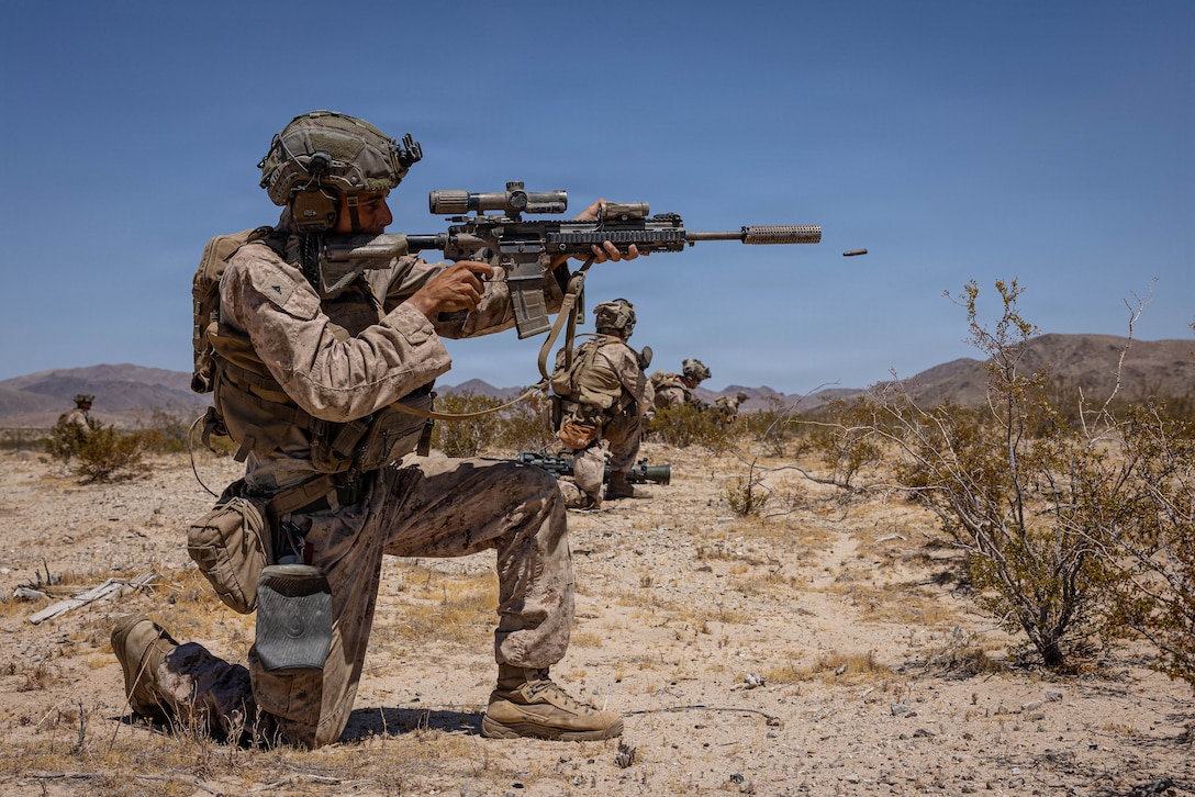 U.S. Marine Corps Lance Cpl. Jaden Wilkerson, a native of Georgia and a team leader with Golf Company, 2nd Battalion, 2nd Marine Regiment, 2nd Marine Division, shoots an M27 Infantry Automatic Rifle during the Mobile Assault Course in Training Area Prospect during Service Level Training Exercise 4-26 on Marine Corps Air Ground Combat Center, Twentynine Palms, California, Aug. 5, 2026. SLTE 4-26 is designed to be a challenging, realistic training environment that produces combat-ready forces capable of operating as an integrated Marine Air Ground Task Force across all domains of military operations. (U.S. Marine Corps photo by Sgt. Alexis French)