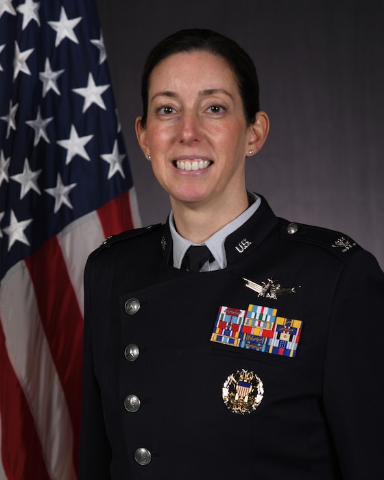 Person in uniform with flag