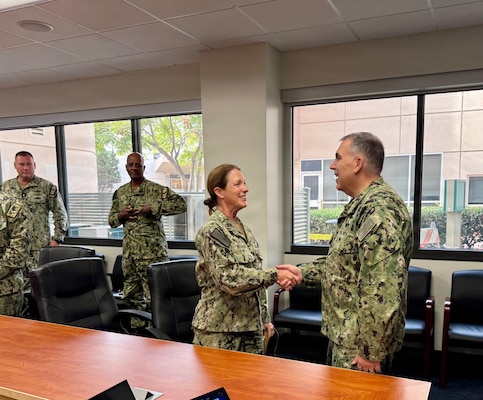 SAN DIEGO (Aug. 6, 2026) – Capt. Shannan Rotruck (left), commanding officer of Expeditionary Medical Facility (EMF) Bravo, shakes hands with Acting Surgeon General and Chief, U.S. Navy Bureau of Medicine and Surgery, Rear Adm. Matthew Case (right) at the start of an executive leadership meeting at Naval Medical Center San Diego (NMCSD). Rotruck represented EMF Bravo during the session as part of Case's broader visit to the command to engage with local Navy Medicine leadership, tour facilities, and recognize deckplate Sailors. (U.S. Navy photo by Contributed)