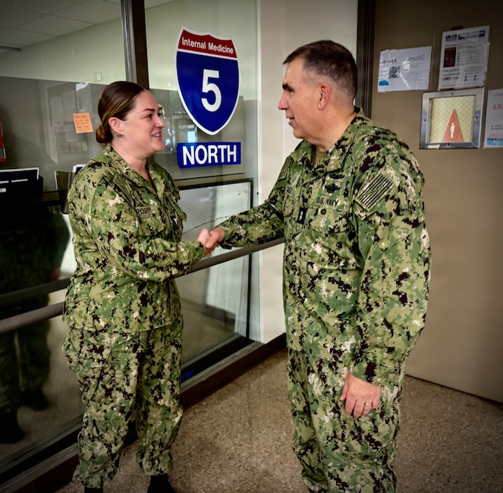 SAN DIEGO (Aug. 6, 2026) – Acting Surgeon General and Chief, U.S. Navy Bureau of Medicine and Surgery, Rear Adm. Matthew Case (right) presents a command coin to Hospital Corpsman 3rd Class Kaitlyn Crosby in the 5 North medical ward at Naval Medical Center San Diego (NMCSD). Case toured the ward to meet directly with staff and recognize outstanding Sailors for their immeasurable dedication to patient care and Navy Medicine's mission. (U.S. Navy photo by Contributed)