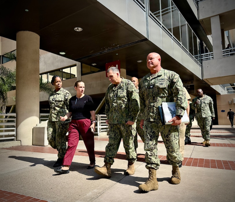 SAN DIEGO (Aug. 6, 2026) – Hospital Corpsman 3rd Class Geraldine Tucker (left) and Jenn Deer, Naval Medical Center San Diego (NMCSD) Patient Relations department head (center left), escort Acting Surgeon General and Chief, U.S. Navy Bureau of Medicine and Surgery, Rear Adm. Matthew Case (center right) and Capt. Jerry J. Bailey, Navy Medicine and Readiness Training Center San Diego (NMRTCSD) commander (right), to NMCSD's newly established Patient Advocacy and Resource Center (PARC). Case visited the command to engage with executive leadership, tour facilities, and recognize deckplate Sailors supporting Navy Medicine's strategic readiness priorities. (U.S. Navy photo by Contributed)