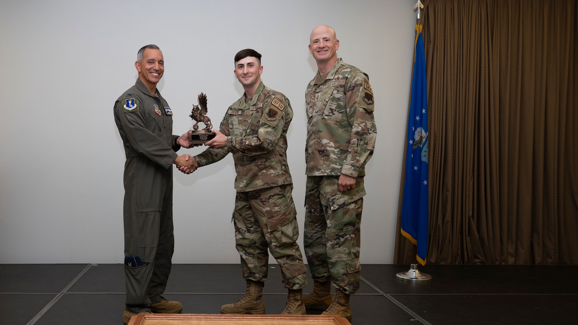 Airmen pose for a photo