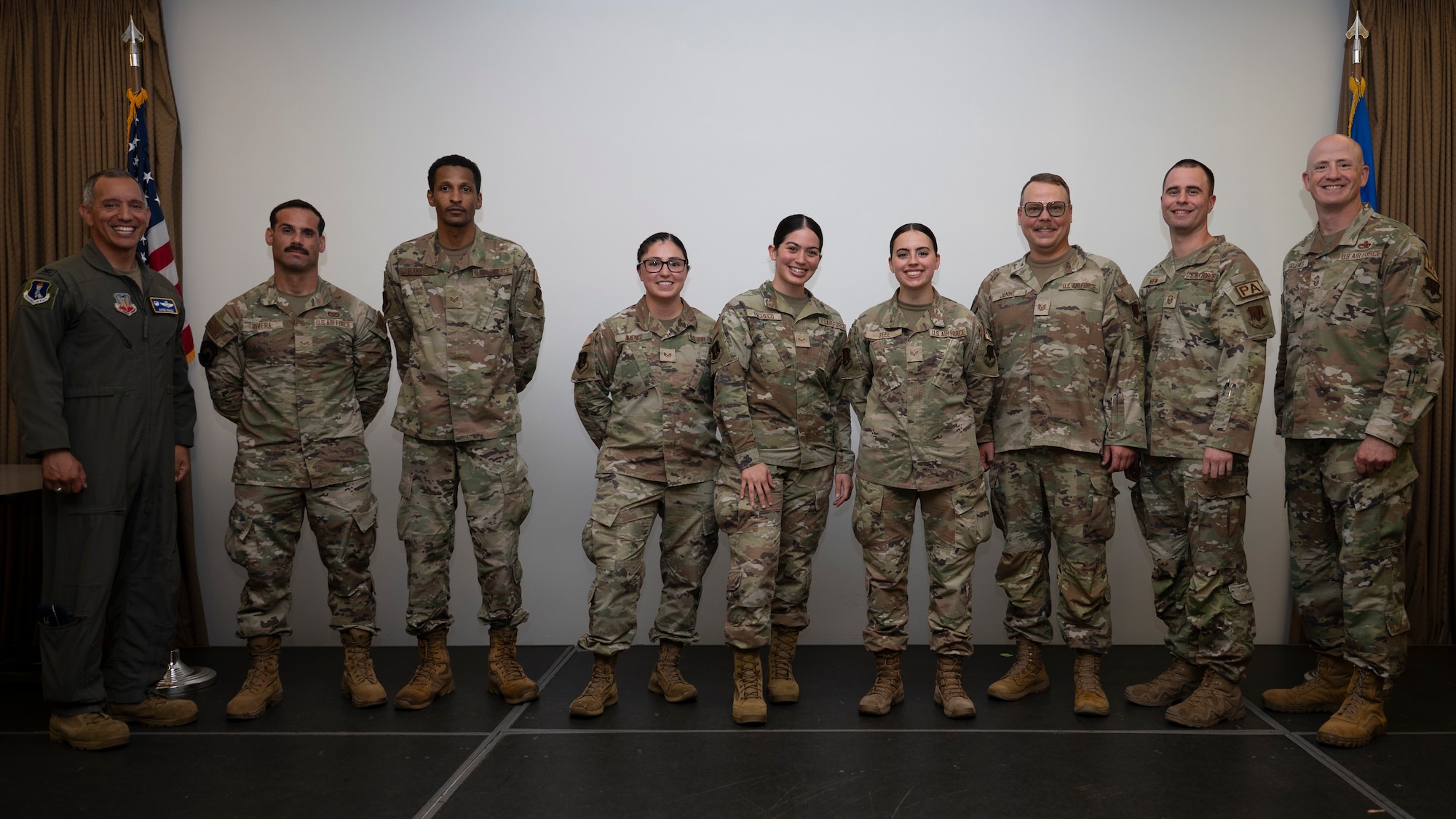 Airmen pose for a photo after winning an award.