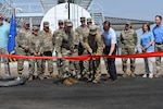 Montana National Guard leaders and project leaders from MEB General Contractors Inc. and the U.S. Army Corps of Engineers cut a ribbon during a ceremony marking the opening of the new petroleum, oil and lubricants complex at the Montana Air National Guard Base in Great Falls, Montana, Aug. 7, 2026. The new complex modernizes fueling infrastructure for the 120th Airlift Wing and supports the wing’s planned transition to the C-130J Super Hercules. Photo by Tech. Sgt. Nicholas Reid.