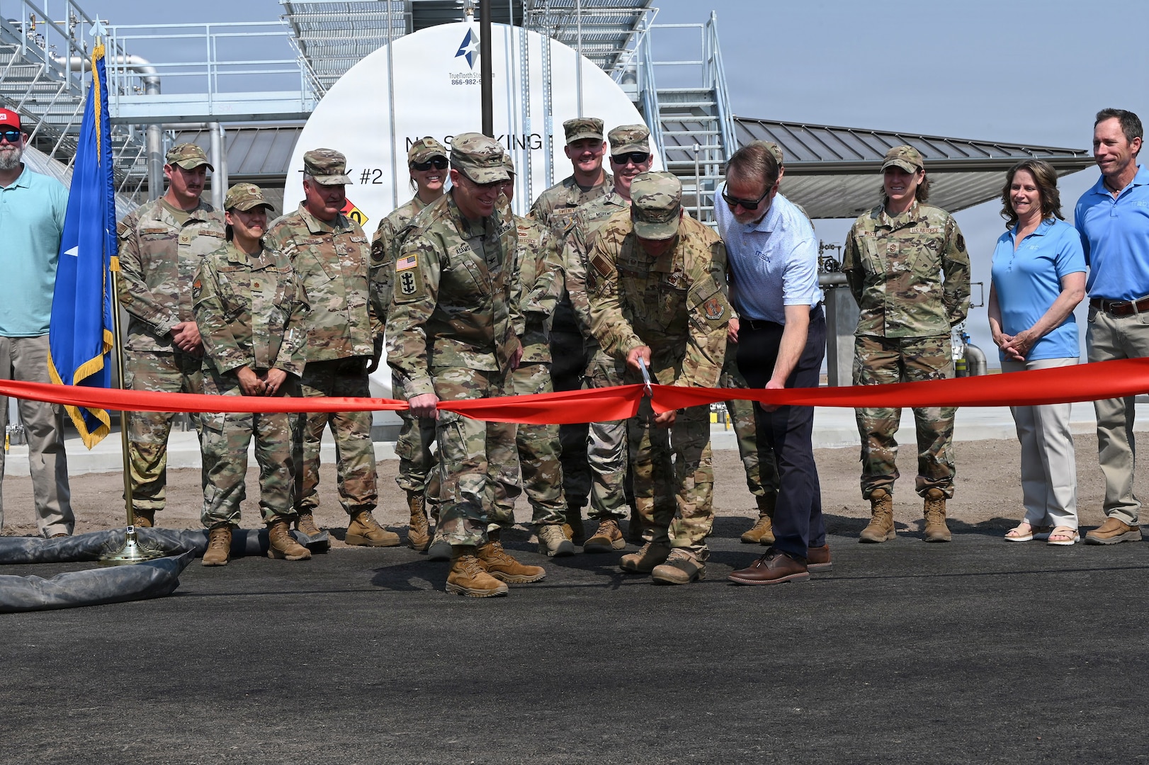 Montana National Guard leaders and project leaders from MEB General Contractors Inc. and the U.S. Army Corps of Engineers cut a ribbon during a ceremony marking the opening of the new petroleum, oil and lubricants complex at the Montana Air National Guard Base in Great Falls, Montana, Aug. 7, 2026.