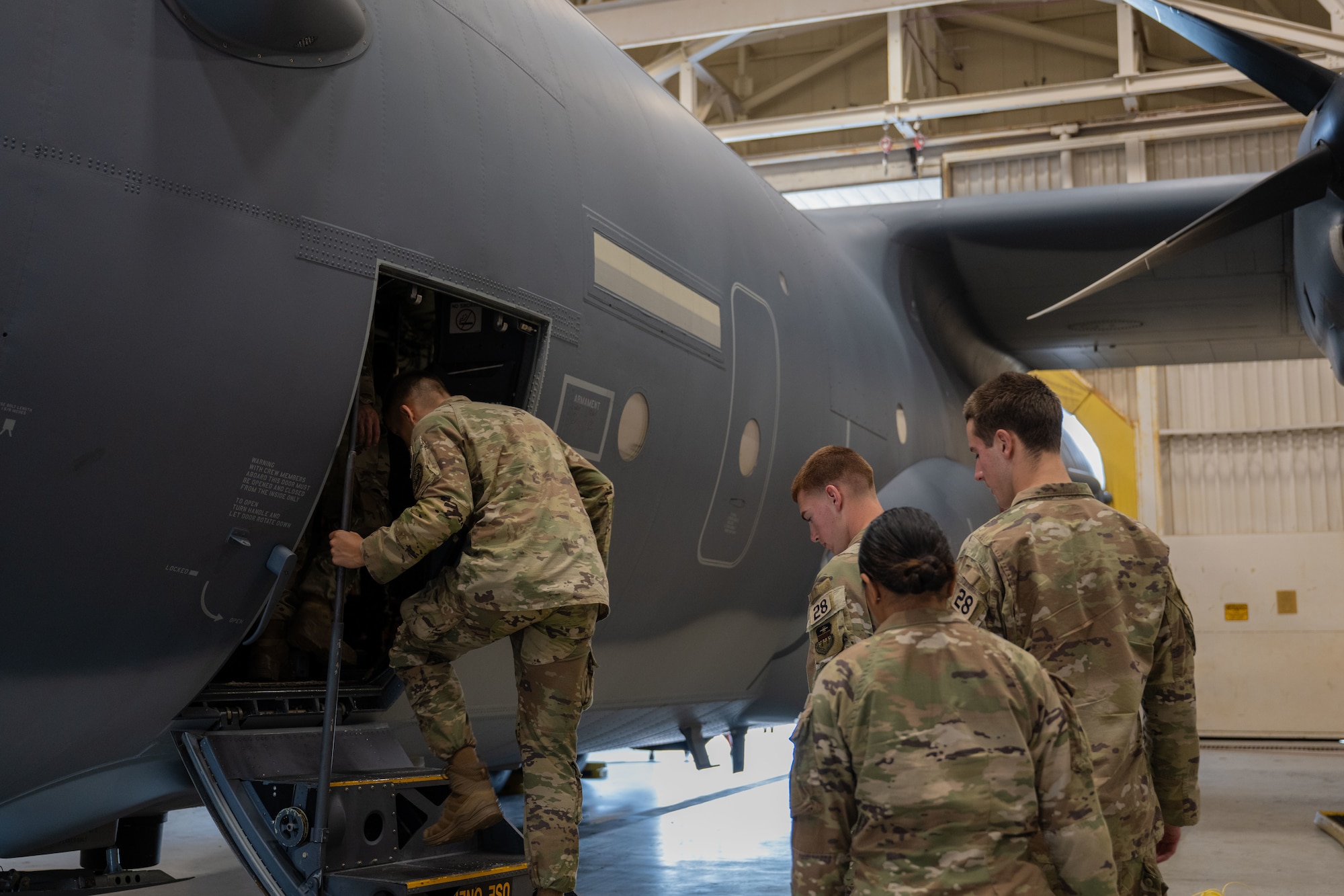 U.S. Air Force Academy cadets enter an MC-130J Commando II assigned to the 1st Special Operations Wing during an Operations Air Force immersion at Hurlburt Field