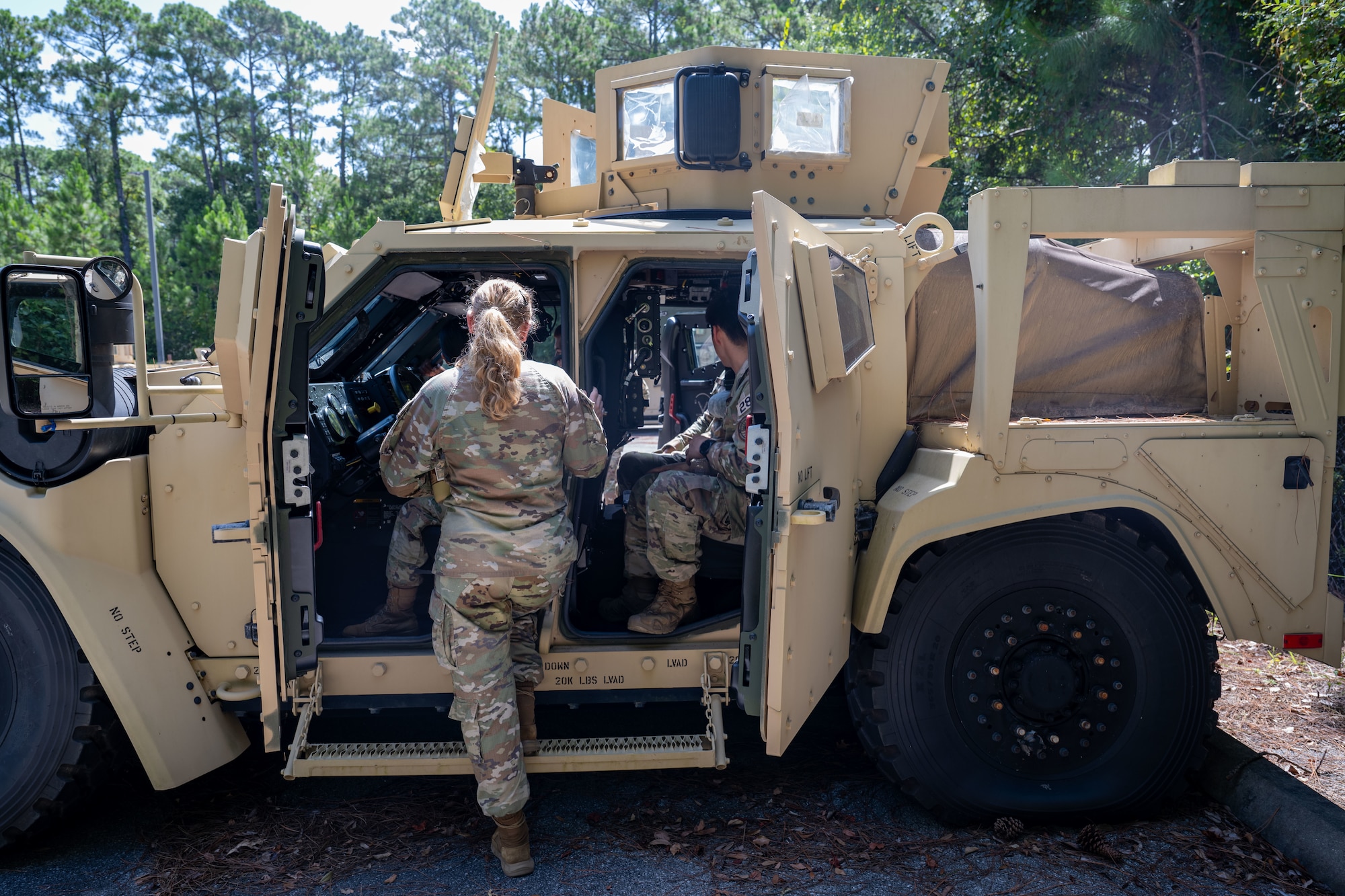 U.S. Air Force Academy cadets sit inside a Joint Light Tactical Vehicle during an immersion at Hurlburt Field