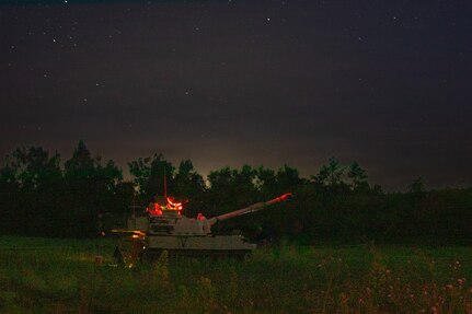 M109A6 Paladins operated by U.S. Army Soldiers assigned to C Battery, 1st Battalion, 201st Field Artillery Regiment, West Virginia Army National Guard, prepare to conduct a nighttime live-fire mission during Exercise Northern Strike 26-2 at the National All-Domain Warfighting Center in Grayling, Michigan, Aug. 6, 2026.