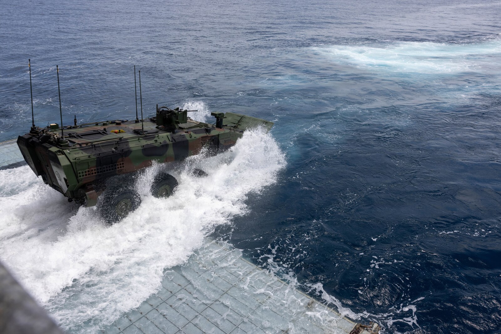 A U.S. Marines Corps Amphibious Combat Vehicle assigned with 3rd Assault Amphibian Battalion, 1st Marine Division debarks off the well deck of Whidbey Island class amphibious dock landing ship USS Ashland (LSD 48) during Quarterly Underway Amphibious Readiness Training 26.4, off the coast of California, July 26, 2026. QUART is a joint training exercise that strengthens amphibious readiness through realistic maritime training, sharpening the warfighting skills of Marines and Sailors to prepare them for crises and to fight west of the International Date Line.   (U.S. Marine Corps photo by Lance Cpl. Ronnie Mejia)