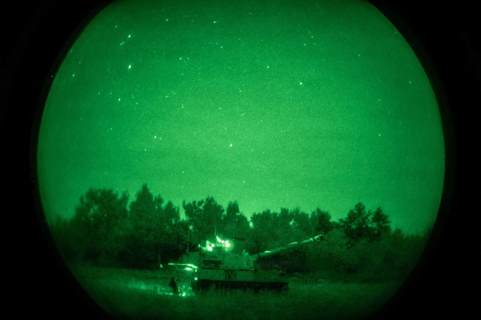 M109A6 Paladins operated by U.S. Army Soldiers assigned to C Battery, 1st Battalion, 201st Field Artillery Regiment, West Virginia Army National Guard, prepare to conduct a nighttime live-fire mission during Exercise Northern Strike 26-2 at the National All-Domain Warfighting Center in Grayling, Michigan, Aug. 6, 2026.