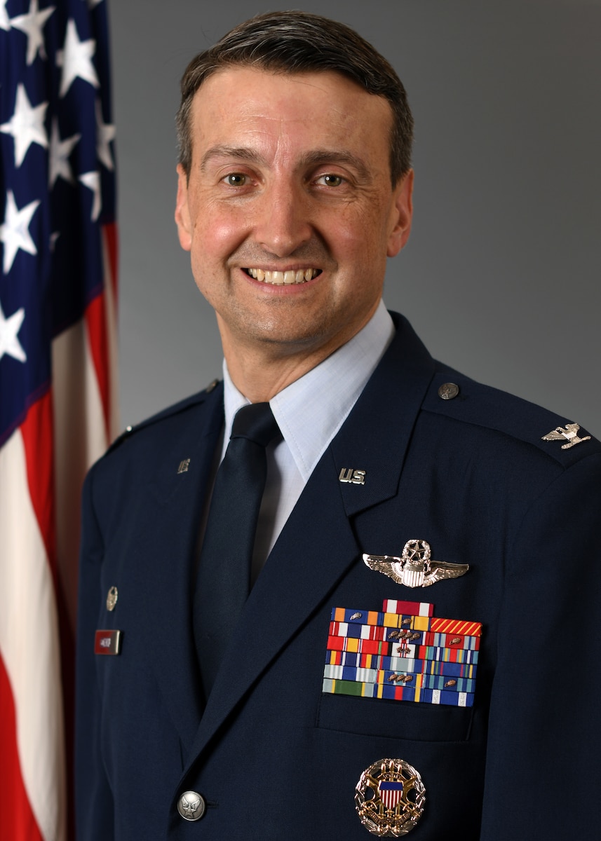 A man with a military uniform poses for an official photo.