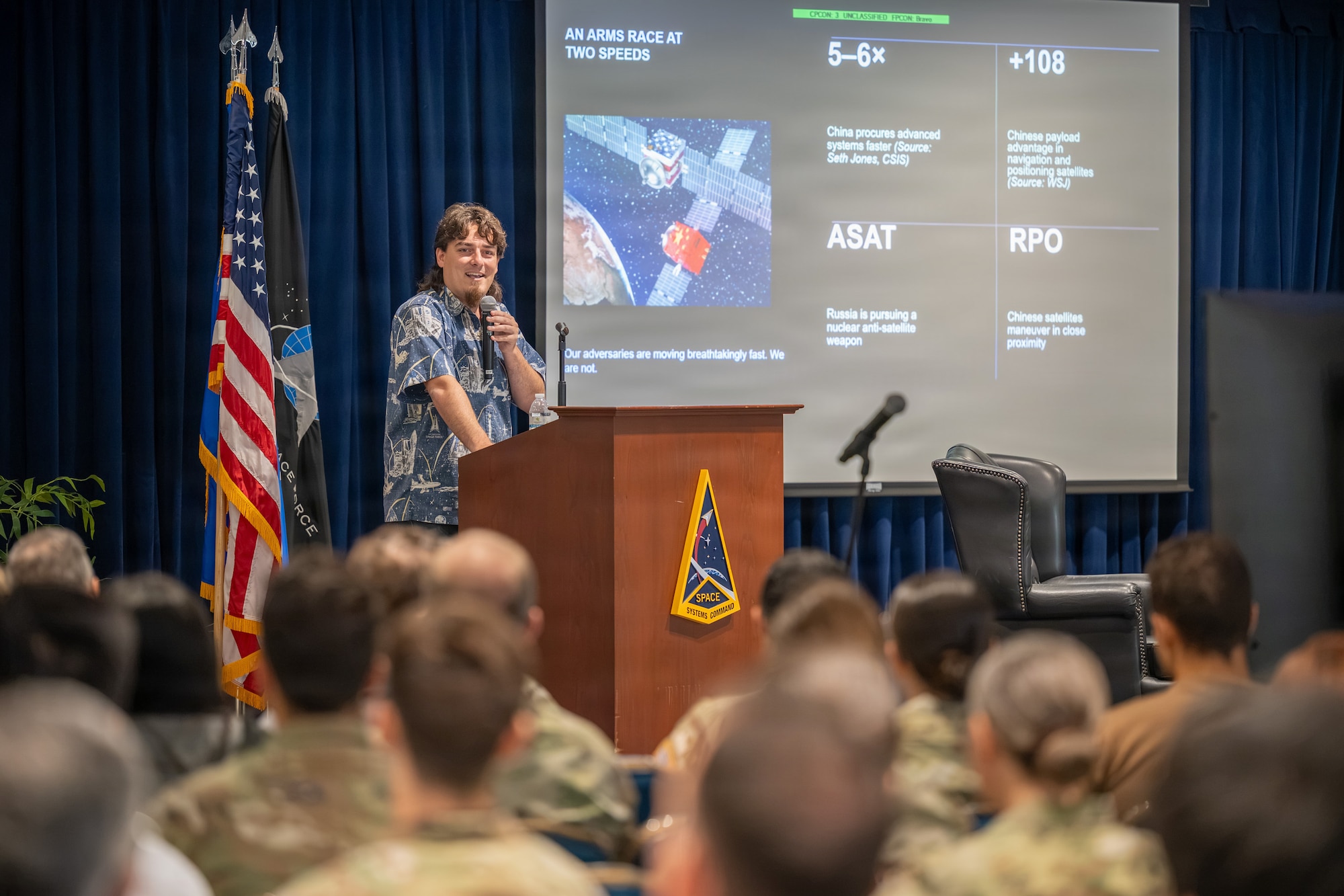Palmer Luckey, founder of Anduril Industries, speaks to members of Space Systems Command's workforce during a “Guardians Everywhere” speakers series event at Los Angeles Air Force Base in El Segundo, California, August 6, 2026. Luckey shared insights on his professional success and the importance of a leadership mindset, emphasizing innovation, rapid development and the role of emerging technology in addressing national security challenges. The Guardians Everywhere series connects SSC's military, civilian and contractor workforce with industry perspectives to enhance mission readiness and strategic thinking. (U.S. Space Force photo by Christopher Kim)