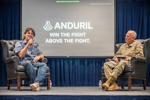 U.S. Space Force Lt. Gen. Philip Garrant, commander of Space Systems Command (SSC), right, speaks with Palmer Luckey, founder of Anduril Industries, during a “Guardians Everywhere” event at Los Angeles Air Force Base in El Segundo, California, August 6, 2026. Guardians, Airmen, civilians and contractors joined the discussion which focused on innovation, leadership mindset and the role of emerging technologies in strengthening national security and space domain awareness. (U.S. Space Force photo by Christopher Kim)