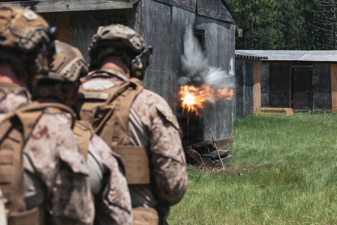 Spanish marines observe a detonating explosive charge while conducting a multinational urban breaching range during Fleet Exercise (FLEETEX) 250 on Marine Corps Base Camp Lejeune, North Carolina, June 18, 2026. FLEETEX 250 represents the United States’ commitment to layer defense of the homeland through forward-deployed forces and reinforces interoperability with allies and partners through collective maritime security. (U.S. Marine Corps photo by Sgt. Jorge Borjas)