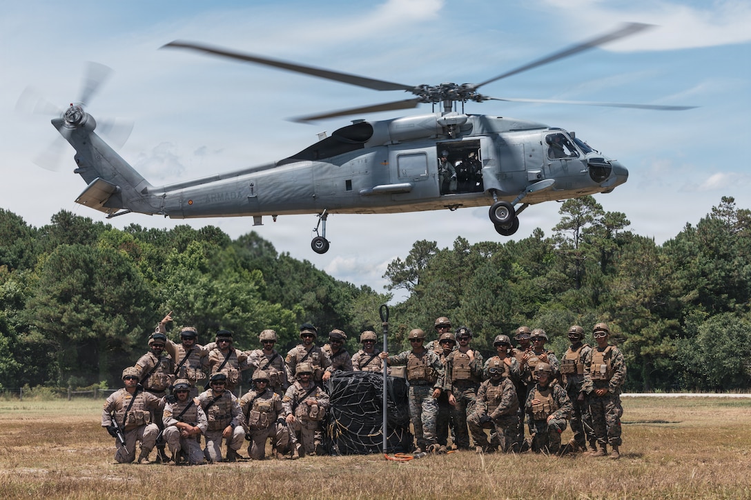 U.S. Marines with Combat Logistics Battalion 22, Combat Logistics Regiment 27, 2nd Marine Logistics Group, and Spanish marines pose for a photo after conducting combined helicopter support team training during Fleet Exercise (FLEETEX) 250 on Marine Corps Base Camp Lejeune, North Carolina, June 20, 2026. FLEETEX 250 represents the United States’ commitment to layer defense of the homeland through forward-deployed forces and reinforces interoperability with allies and partners through collective maritime security. (U.S. Marine Corps photo by Sgt. Jorge Borjas)