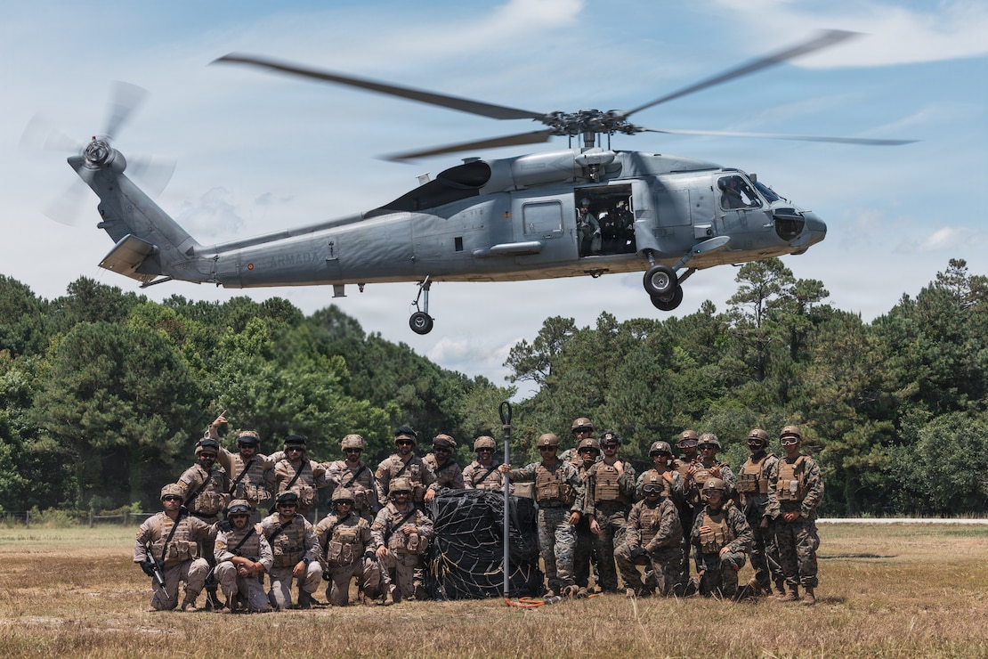 U.S. Marines with Combat Logistics Battalion 22, Combat Logistics Regiment 27, 2nd Marine Logistics Group, and Spanish marines pose for a photo after conducting combined helicopter support team training during Fleet Exercise (FLEETEX) 250 on Marine Corps Base Camp Lejeune, North Carolina, June 20, 2026. FLEETEX 250 represents the United States’ commitment to layer defense of the homeland through forward-deployed forces and reinforces interoperability with allies and partners through collective maritime security. (U.S. Marine Corps photo by Sgt. Jorge Borjas)