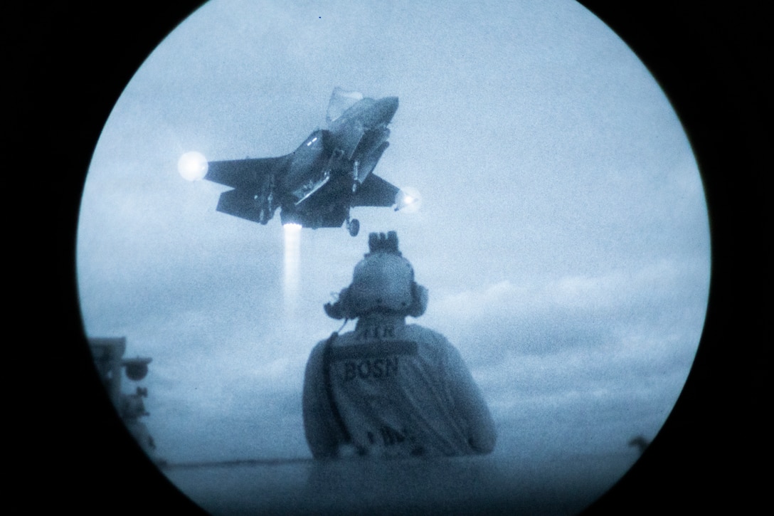 A U.S. Marine Corps F-35B Lightning II assigned to Marine Fighter Attack Squadron (VMFA) 542, 2nd Marine Aircraft Wing hovers above Wasp-class amphibious assault ship USS Kearsarge (LHD 3) while conducting low-light carrier qualifications during 26th Marine Expeditionary Unit’s Type Commander's Amphibious Training (TCAT), off the coast of North Carolina, June 11, 2026. TCAT is a military exercise designed to enhance mobility and integration between the U.S. Marine Corps and the U.S. Navy. The amphibious force is an integrated powerhouse providing sea, land, and air operations, giving geographic combatant commanders a more flexible, agile force for aggregated or dis-aggregated operations across the globe. (U.S. Marine Corps photo by Cpl. Matthew Williams)