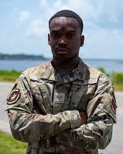A man in military uniform poses for a photo.