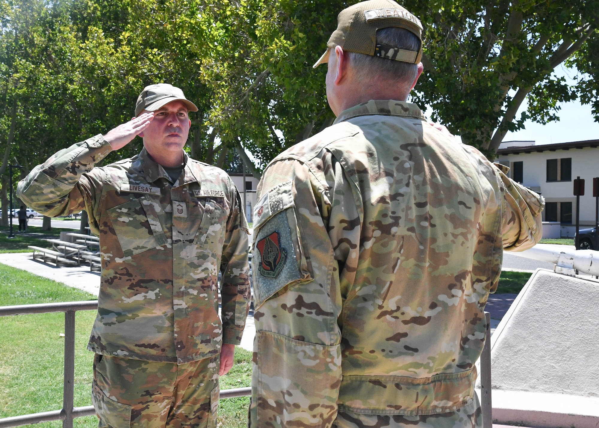 Senior Master Sgt. Mathew Livesay, Air Force Safety Center nuclear surety team member, renders a final salute on his last day of active duty to Col. Chris Weaton, AFSC deputy commander, to thank Weaton for his leadership, support and the honor of serving at the AFSC, Kirtland Air Force Base, New Mexico, August 3, 2026