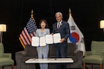 Kang Yunjin, Vice Minister of Republic of Korea Ministry of Patriots and Veterans Affairs, and Kelly McKeague, director of the Defense POW/MIA Accounting Agency, pose for a photo with the signed memorandum of understanding at the Korean/ Cold War Annual Government Briefing in Omaha, Nebraska, Aug. 7, 2026.