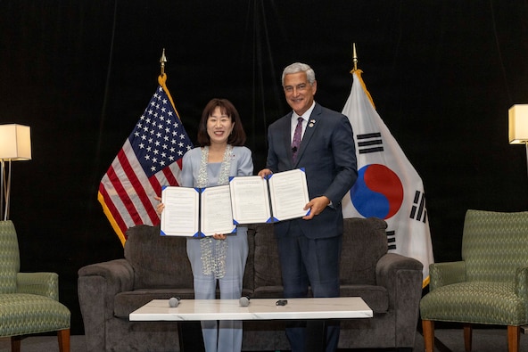 Kang Yunjin, Vice Minister of Republic of Korea Ministry of Patriots and Veterans Affairs, and Kelly McKeague, director of the Defense POW/MIA Accounting Agency, pose for a photo with the signed memorandum of understanding at the Korean/ Cold War Annual Government Briefing in Omaha, Nebraska, Aug. 7, 2026.